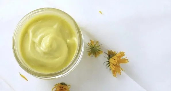 A jar of creamy calendula body butter.