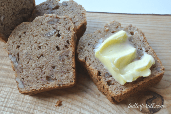 Sliced banana date bread with butter.