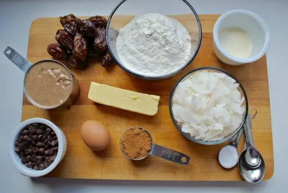 Overhead view of almond cookie ingredients on a cutting board.