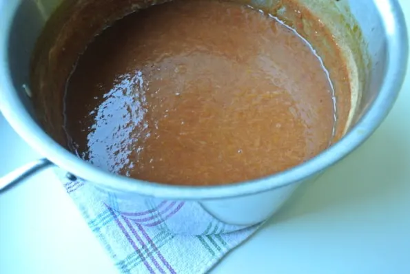Yellow plum puree in a pot.