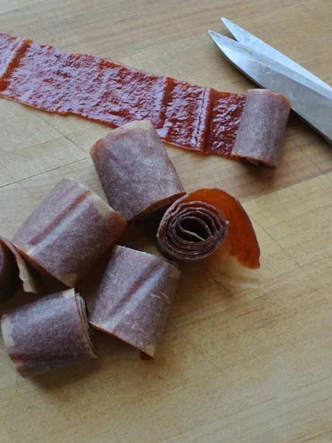 Plum fruit leather cut into spiral pieces.