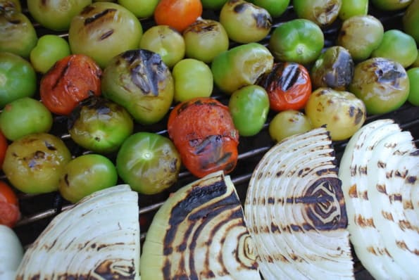 Lightly charred fire roasted tomatillos, tomatoes, and onions. 