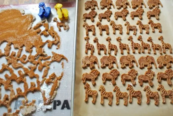 Cookie sheets with animal cookie cut outs ready to bake.