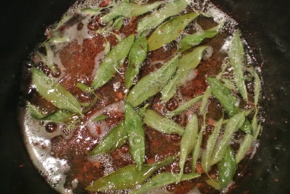 Sage leaves cooking in pork drippings.