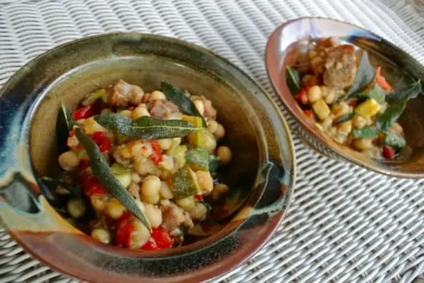 Two bowls of pork belly and shelling bean stew.