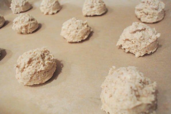 Coconut oil drop biscuits on a sheet before baking.