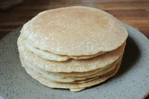 A stack of steamy sourdough pancakes.