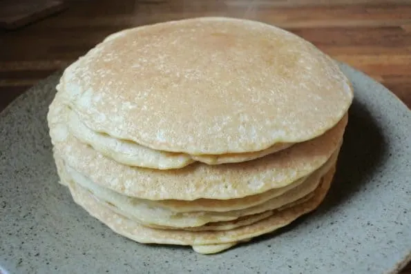 A stack of steamy sourdough pancakes.