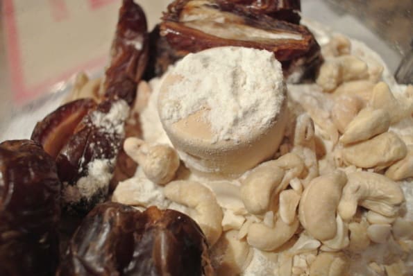 Dates and cashews in a food processor.