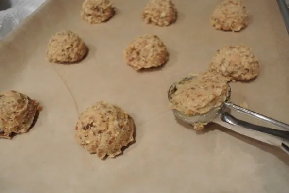 Cookie dough scoops on a baking sheet.