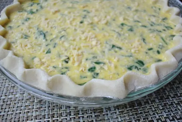 An unbaked quick 12-egg quiche.