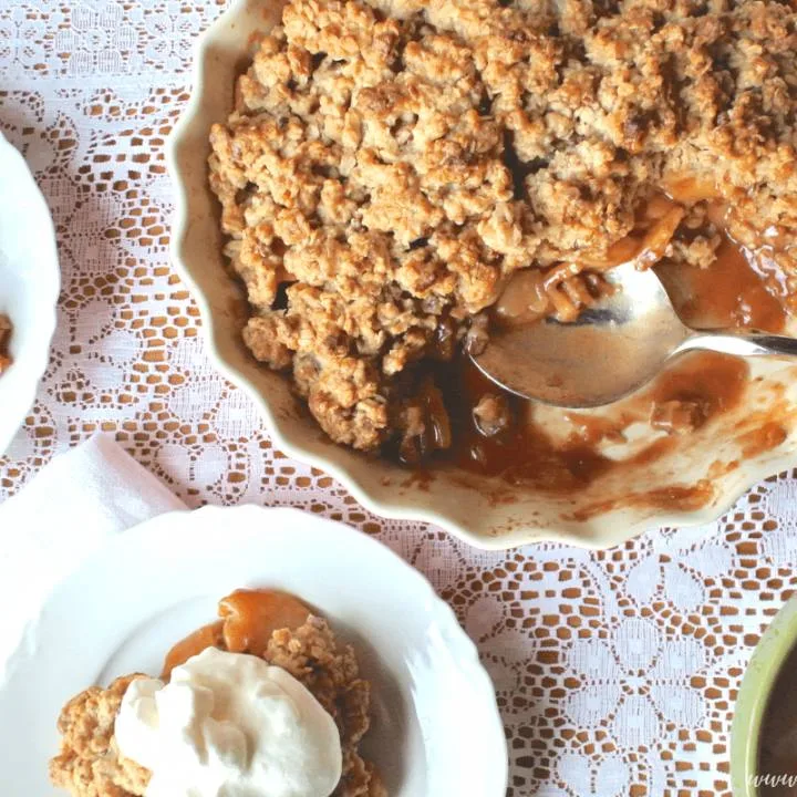 The perfect Apple Crisp with cinnamon spiced cooked apples and a buttery oatmeal cooking topping!