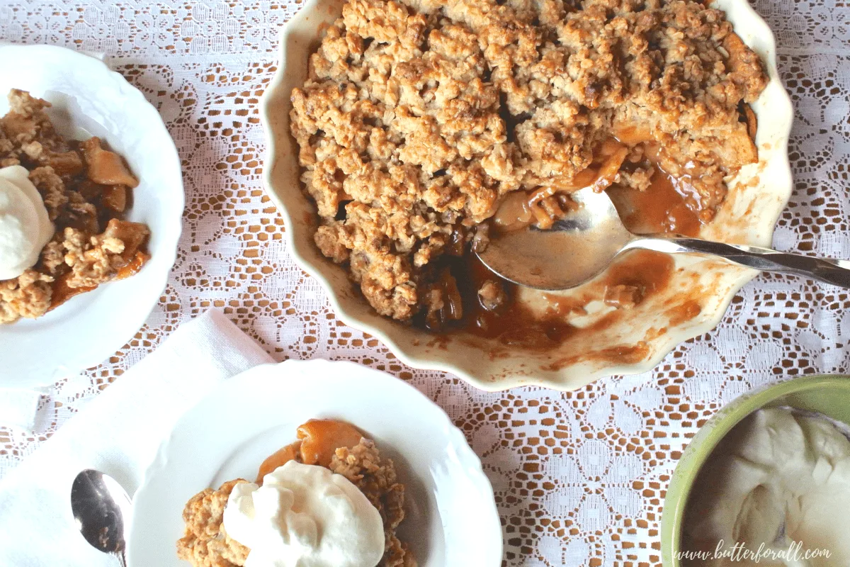 The perfect Apple Crisp with cinnamon spiced cooked apples and a buttery oatmeal cooking topping!