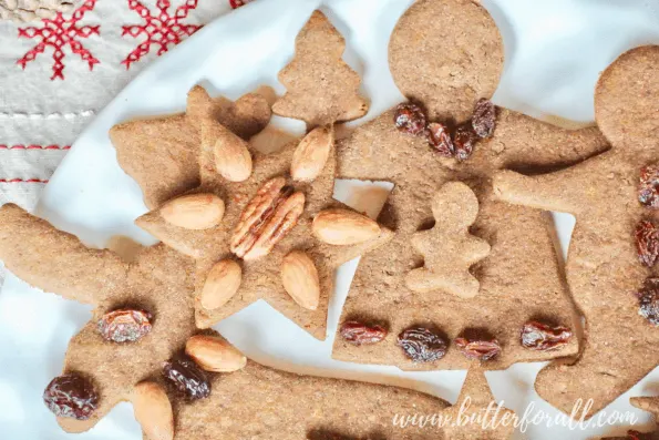 A plate of pretty decorated gingerbread cut-out cookies.