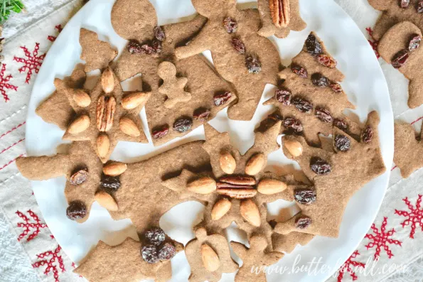 A big platter of festive decorated gingerbread cut-out cookies.