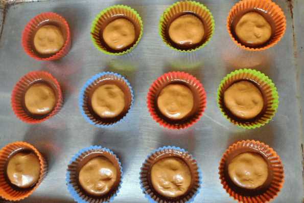 Baking cups filled with peanut butter filling.