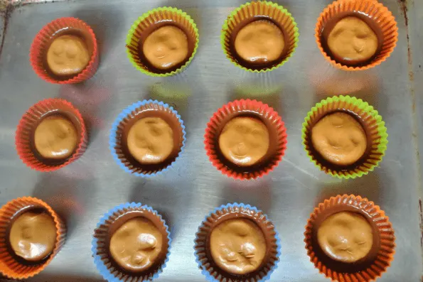 Baking cups filled with peanut butter filling.