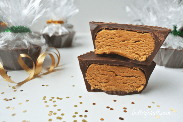 Chocolate peanut butter cups cut in half to show filling.