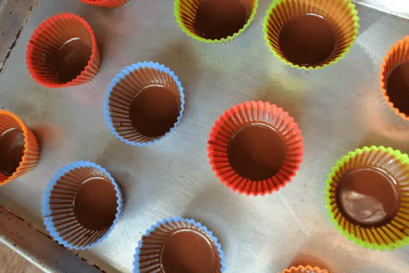 Baking cups with one coat of chocolate.