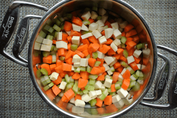 Diced vegetables in a colander.