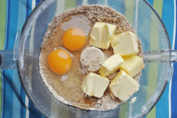 Butter and eggs added to the mixed dry ingredients.