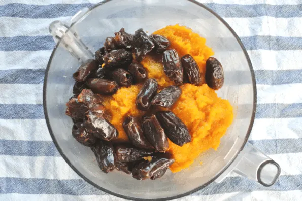 Pureed winter squash and dates in a glass bowl.