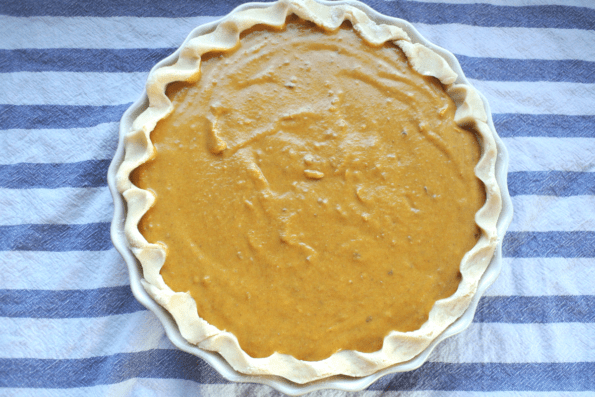 An unbaked winter squash pie.
