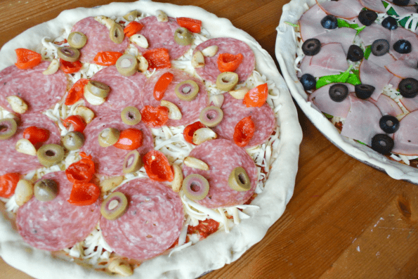 Sourdough pizza with toppings, ready to bake.