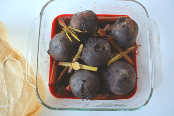 A glass dish of roasted beets and fennel.