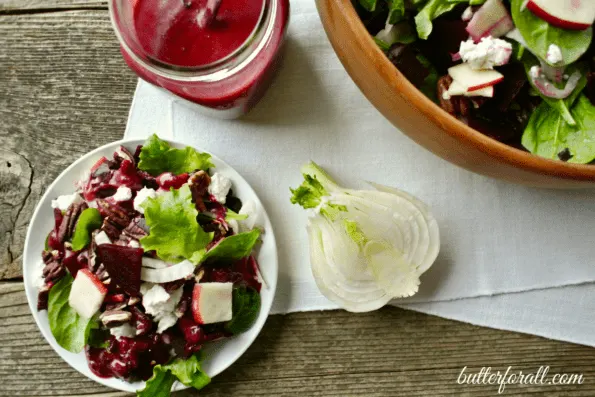 A plate of fennel, beet, and apple salad.
