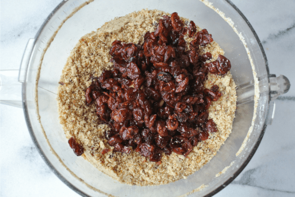 Dry ingredients plus cranberries in a mixing bowl.