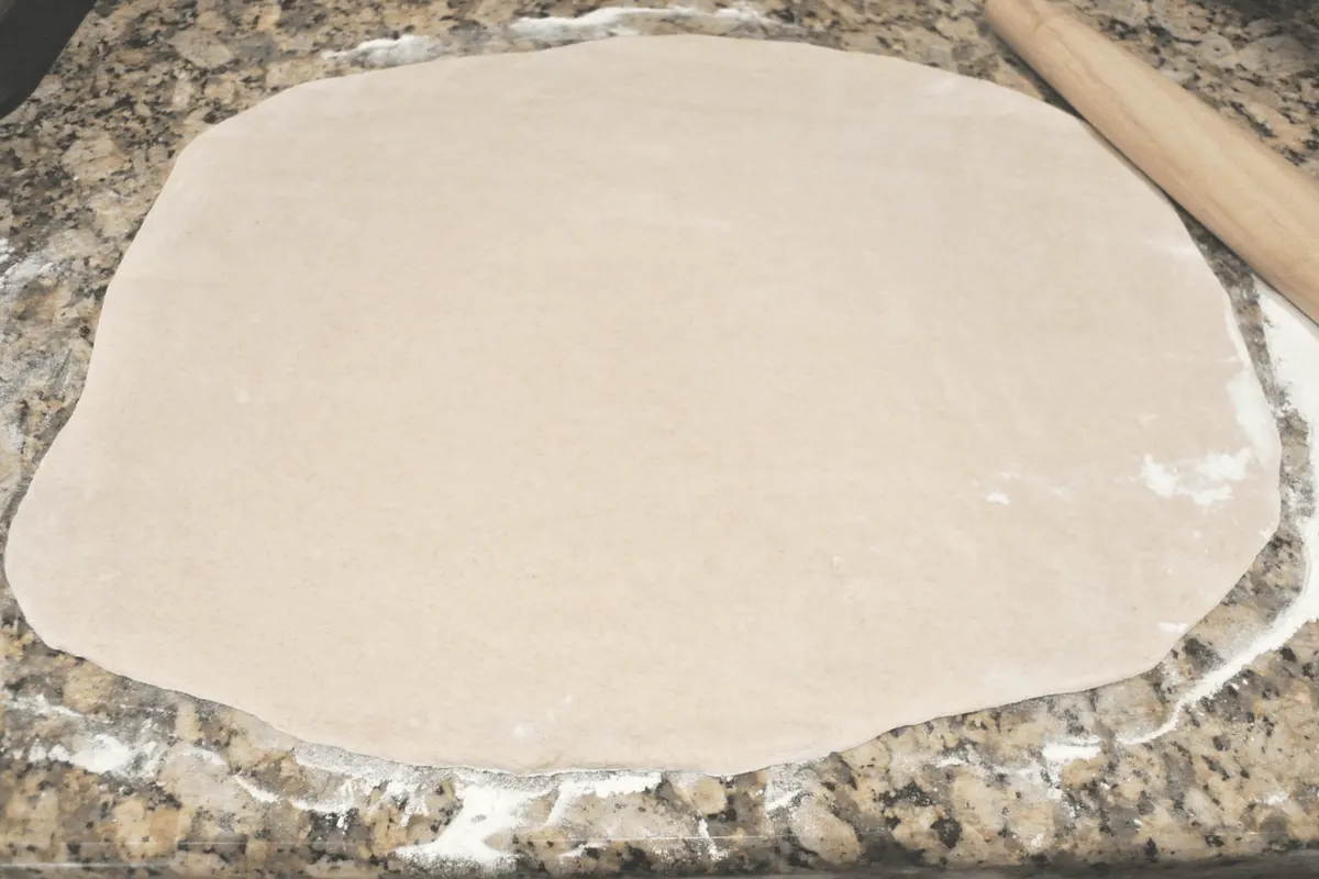 Sourdough dough rolled out n the counter.