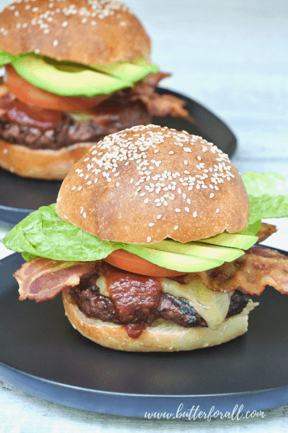 A close-up of a burger made with sourdough buns.