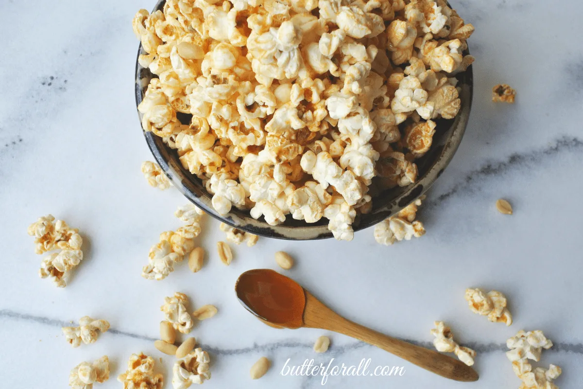 A close-up of a bowl of honey nut popcorn.