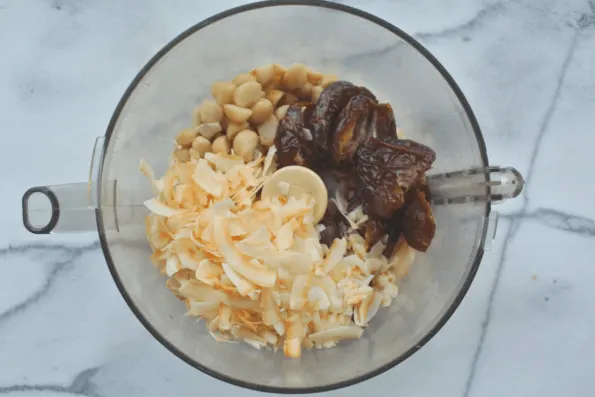 Dry ingredients in a food processor bowl.