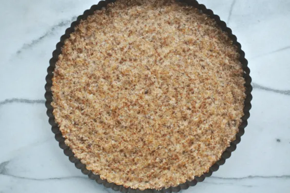 The completed crust pressed into a tart pan.