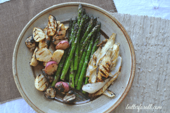 Tahini-marinated grilled vegetables on a plate.