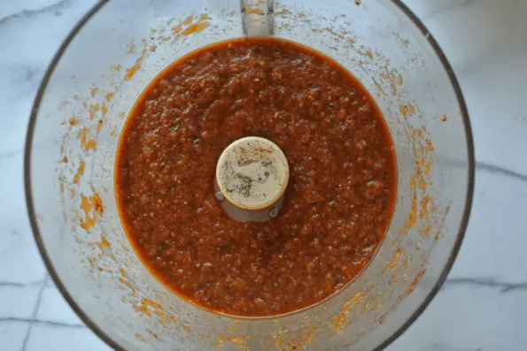 The marinade in a food processor bowl.
