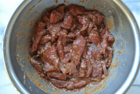 The beef strips in the marinade.