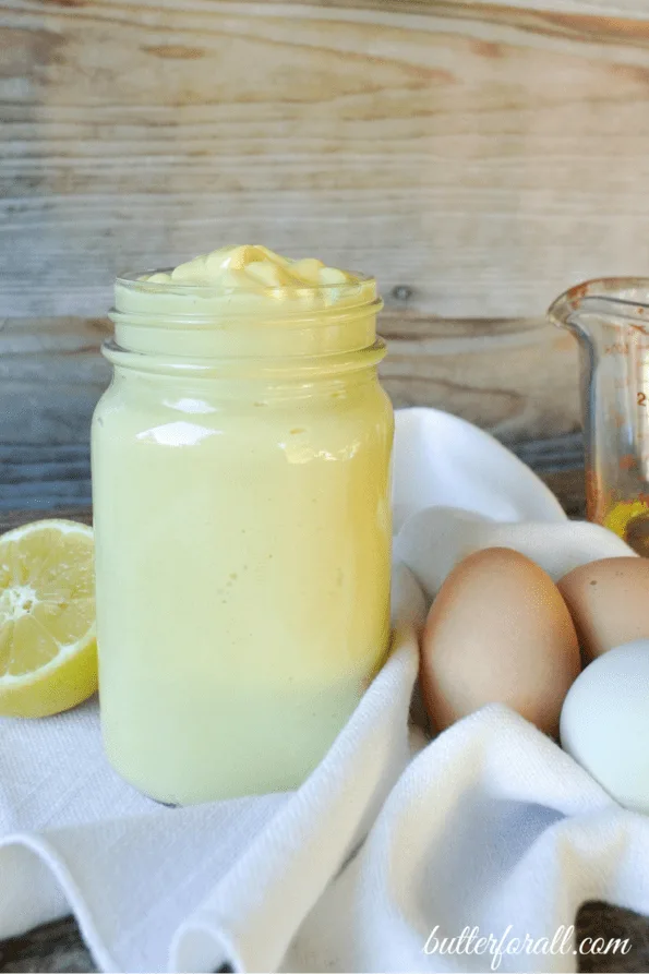 A jar of probiotic mayonnaise on a table.