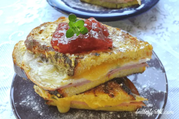 A finished Monte Cristo topped with strawberry jam.
