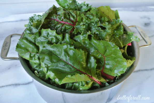 A colander full of washed greens.