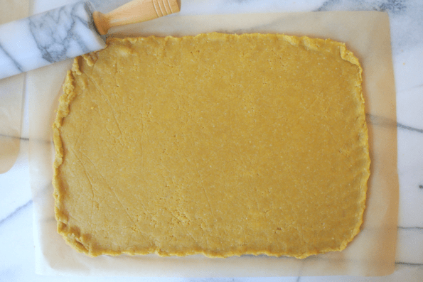 Cracker dough rolled out onto parchment.