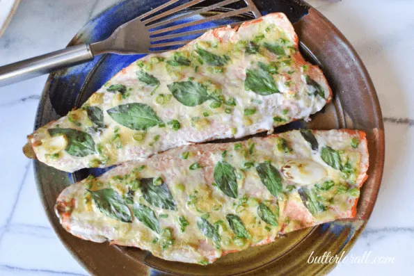 Baked salmon fillets on a plate.