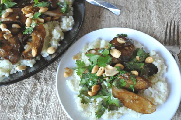 Plated Japanese eggplant stir fry served over cauliflower rice.