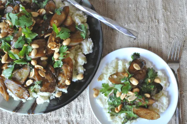 Plated Japanese eggplant stir fry served over cauliflower rice.