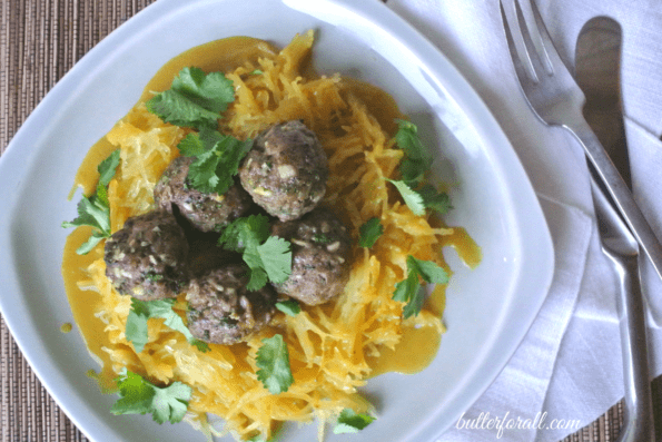 A plate of spicy lamb meatballs with spaghetti squash.