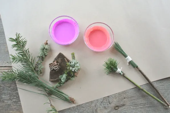 Pots of paint and pine needle brushes.