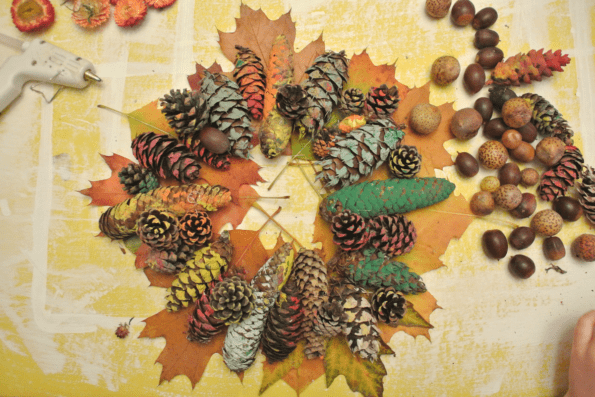 Colorful autumn leaves and painted pinecones for a wreath.