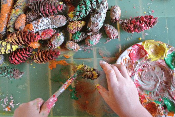 Pinecones being painted.